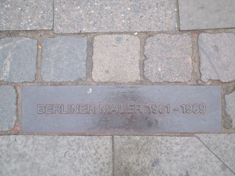 One of the many Berlin Wall markers where it once stood